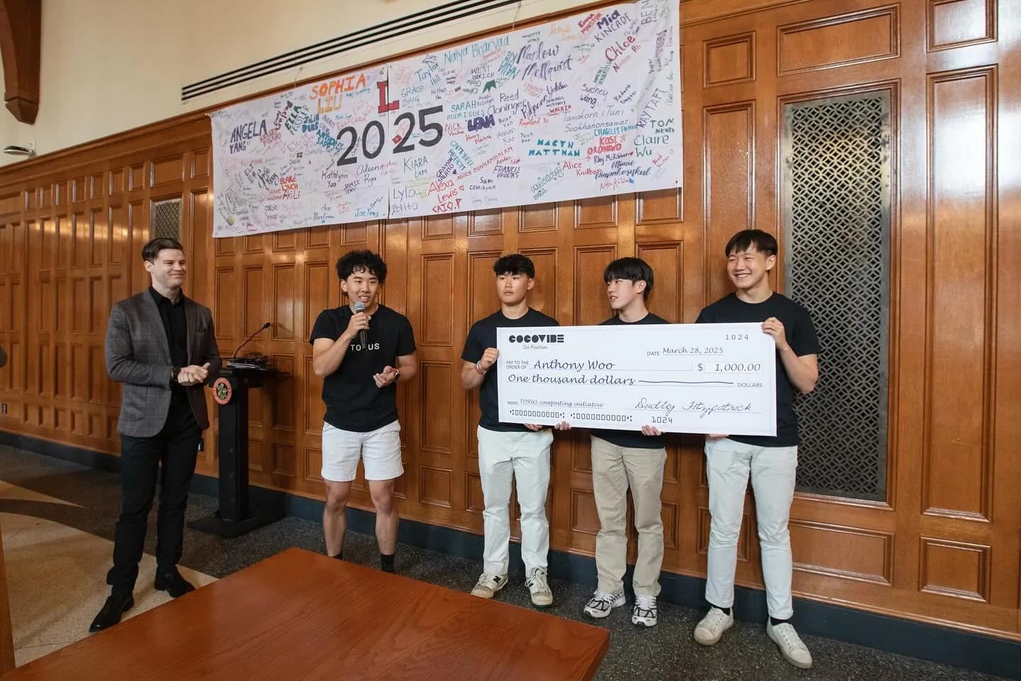 Torus team gathered around a bucket display at an event