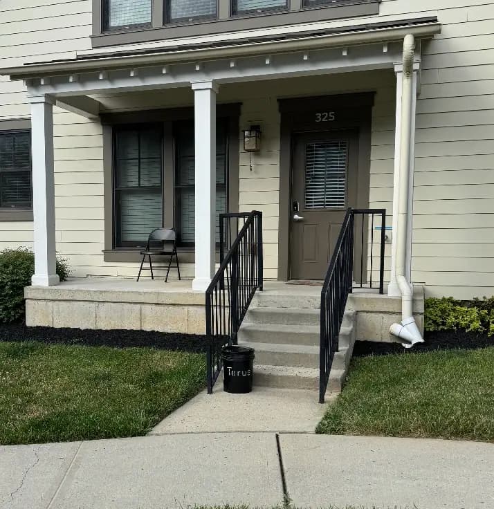Torus compost bucket outside a residential front porch, delivered for a new member