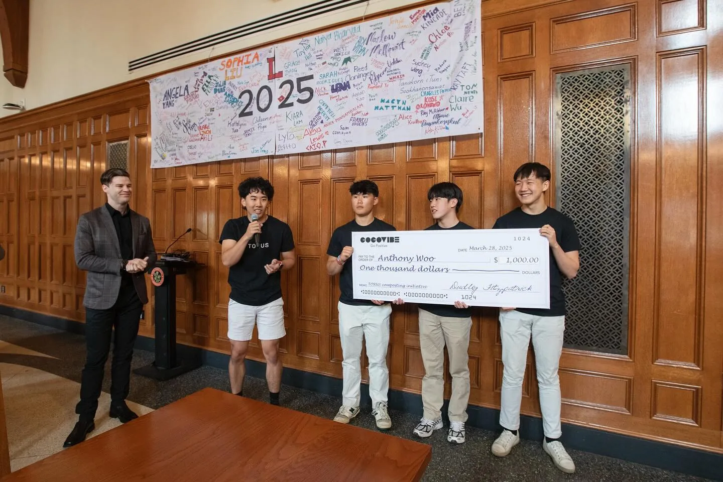 Torus team gathered around a bucket display at an event