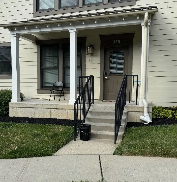 Torus compost bucket outside a residential front porch, delivered for a new member